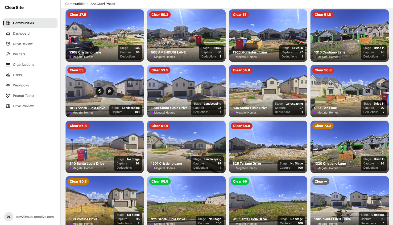 Sixteen lots in a community, each with a photo from the drive, a Clear score, the build stage, how much was captured and the number of deductions.